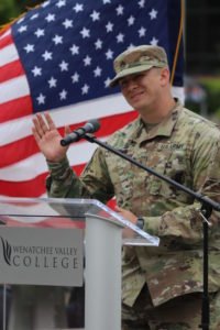 Army recruiter speaks at the podium