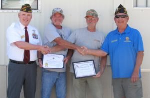 VFW Post 3617 and American Legion Post 10 Commanders present certificates to Don and Dan Smith, owners of Riverway Contracting