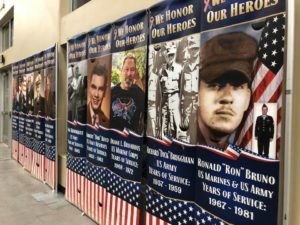 Stretch of wall with multiple Heroes banners on display